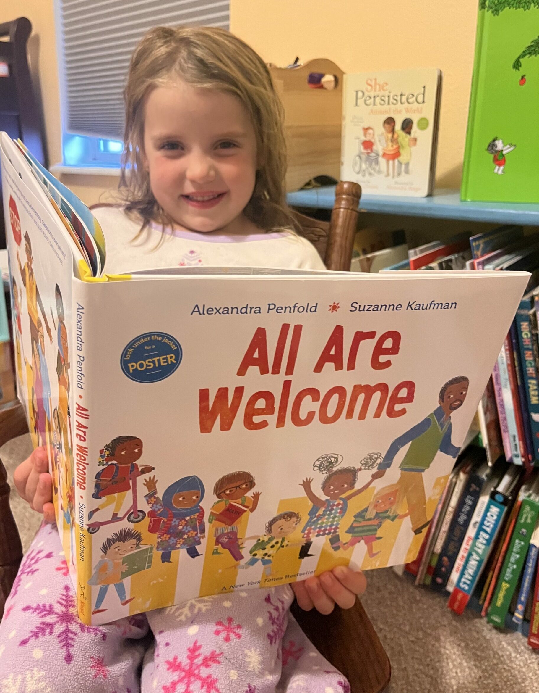 Addy reading All Are Welcome