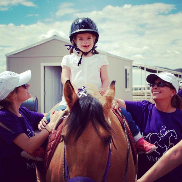 Lisette enjoying her ride on her horse Maggie.