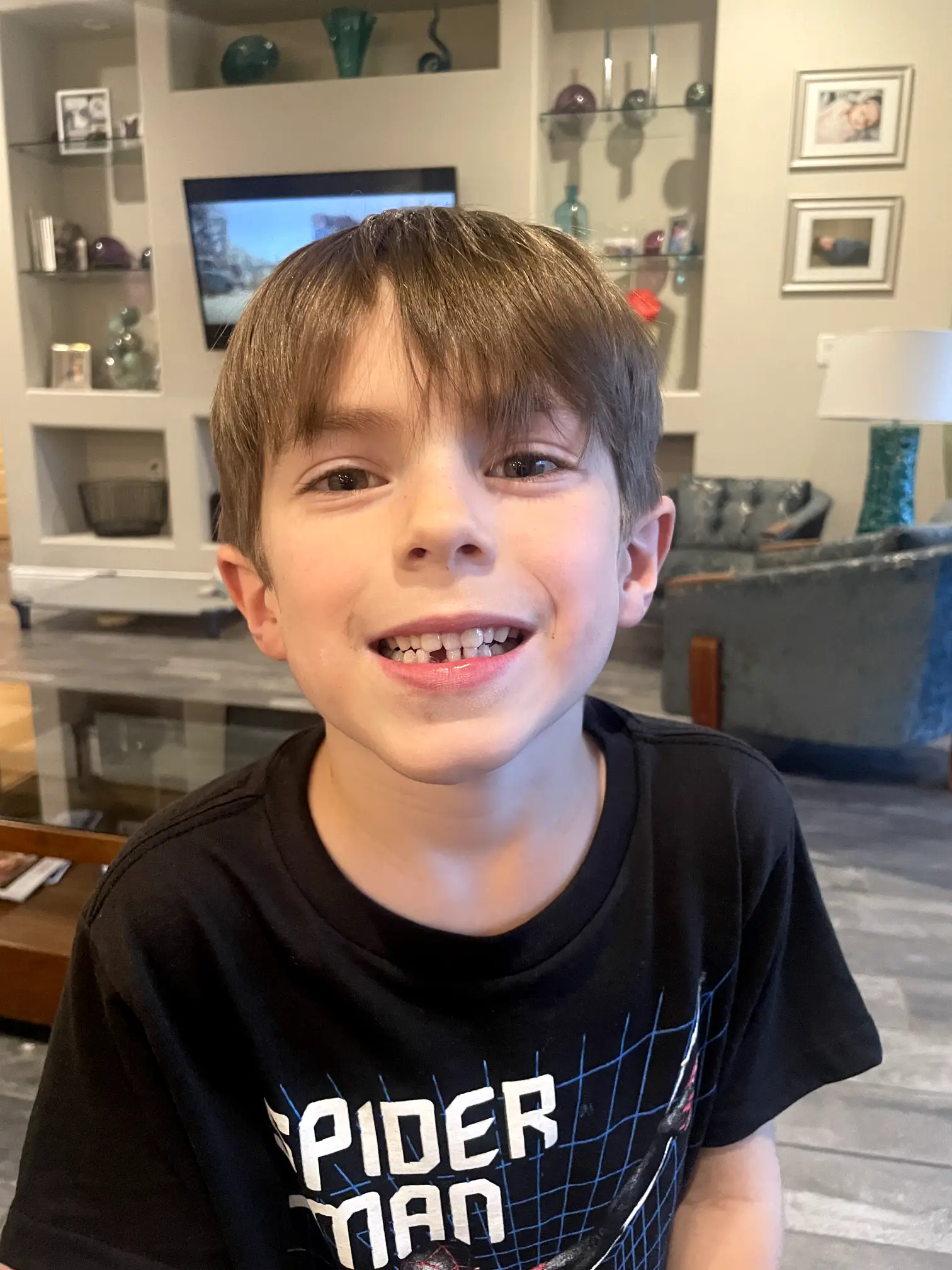 Down one tooth, Ryker, age 6, is flashing his new smile.