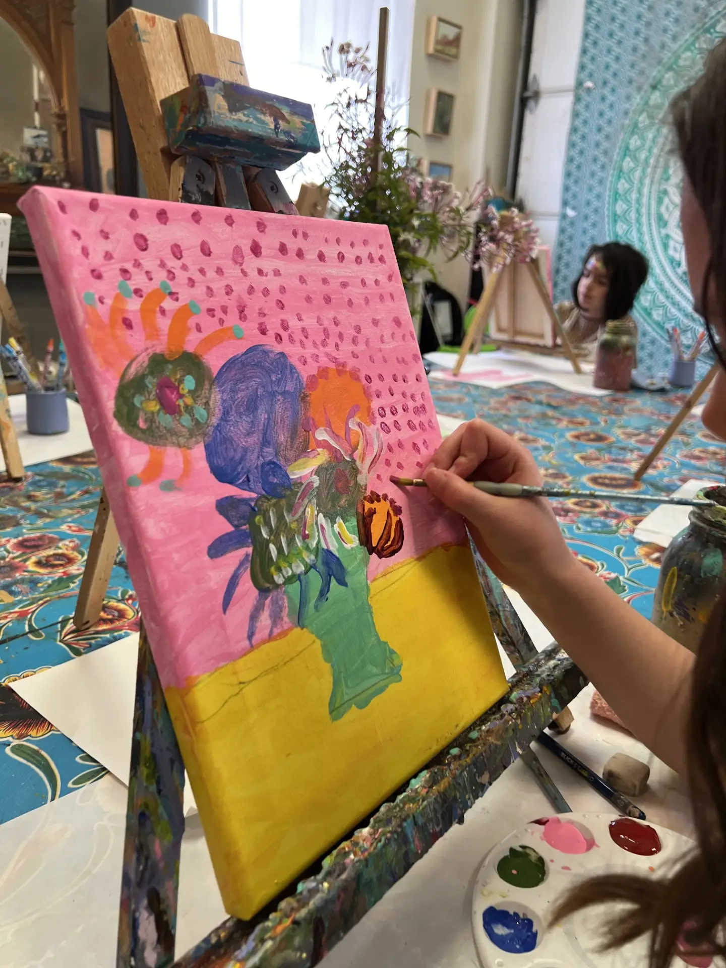 Student painting flowers