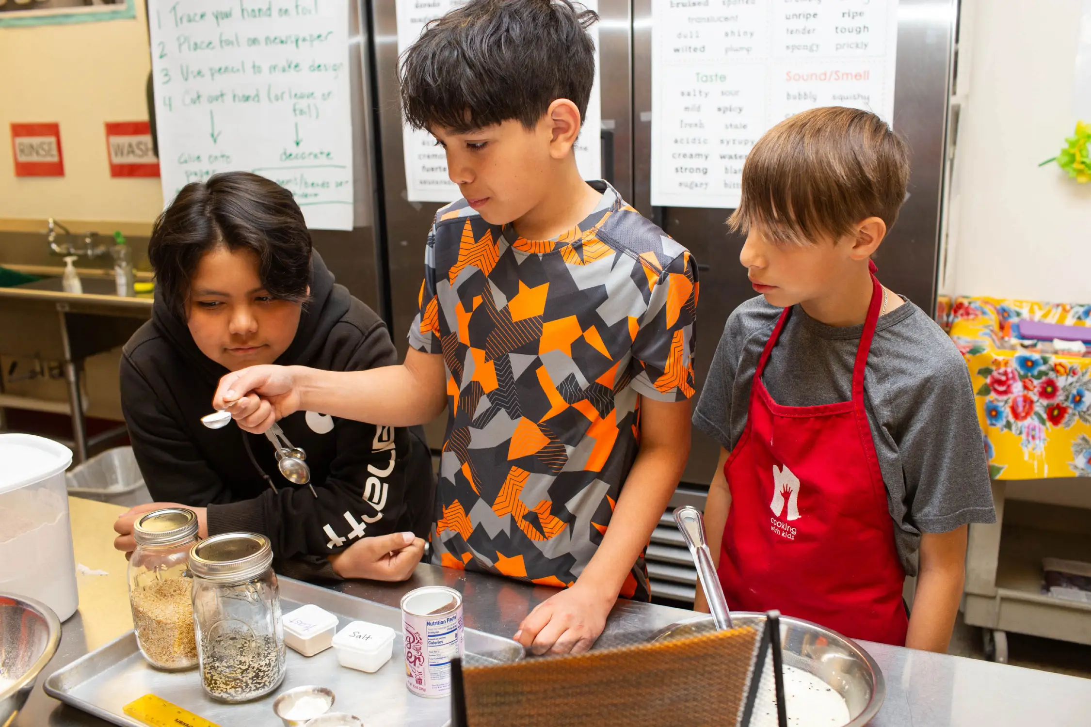 CWK_Measuring_PhotoCredit Kerry Sherck Fifth graders measuring ingredients for flatbread.