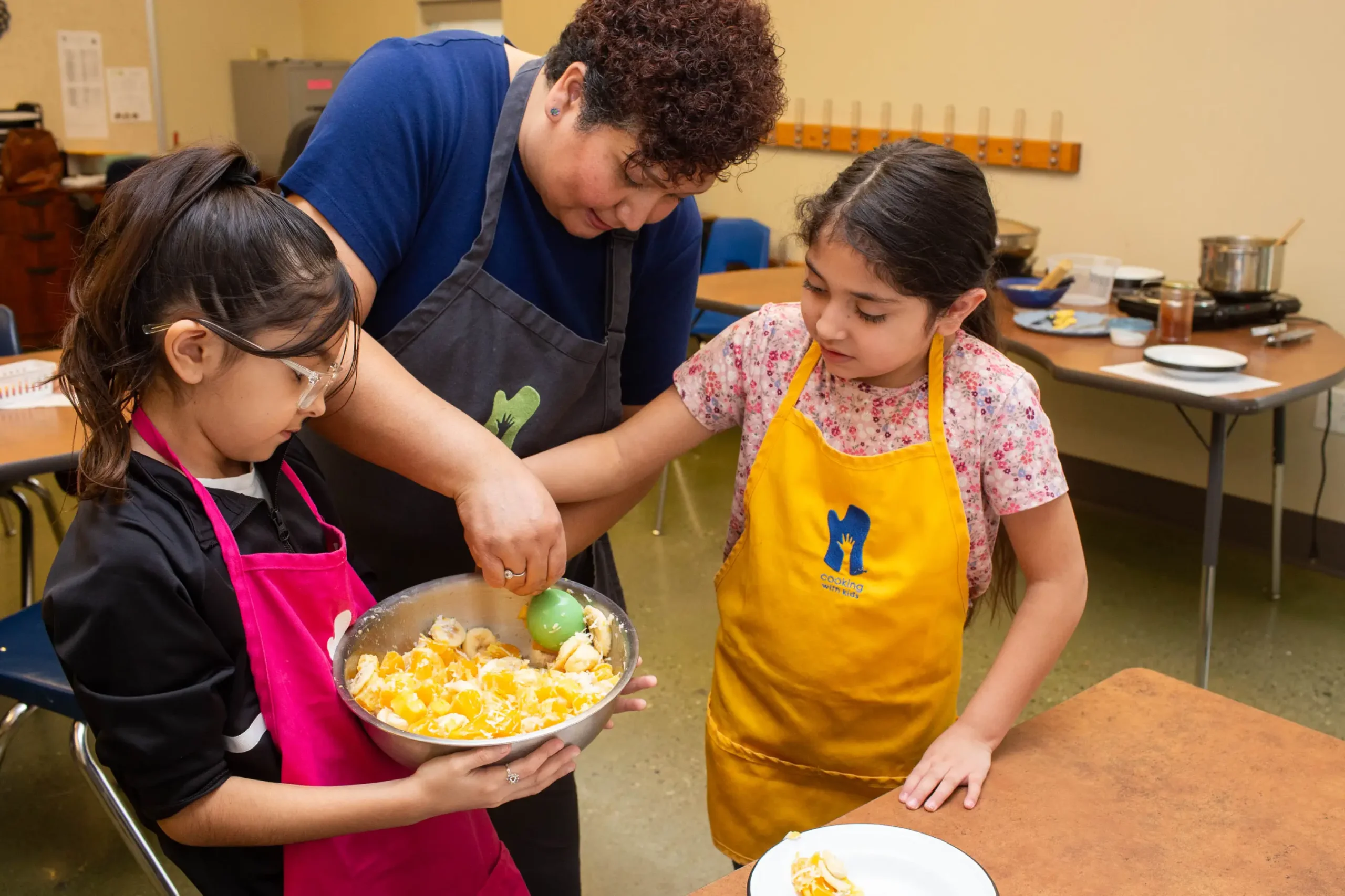 CWK_Plating Food_PhotoCredit Kerry Sherck With some guidance, kids can help plate food to be served at celebrations.
