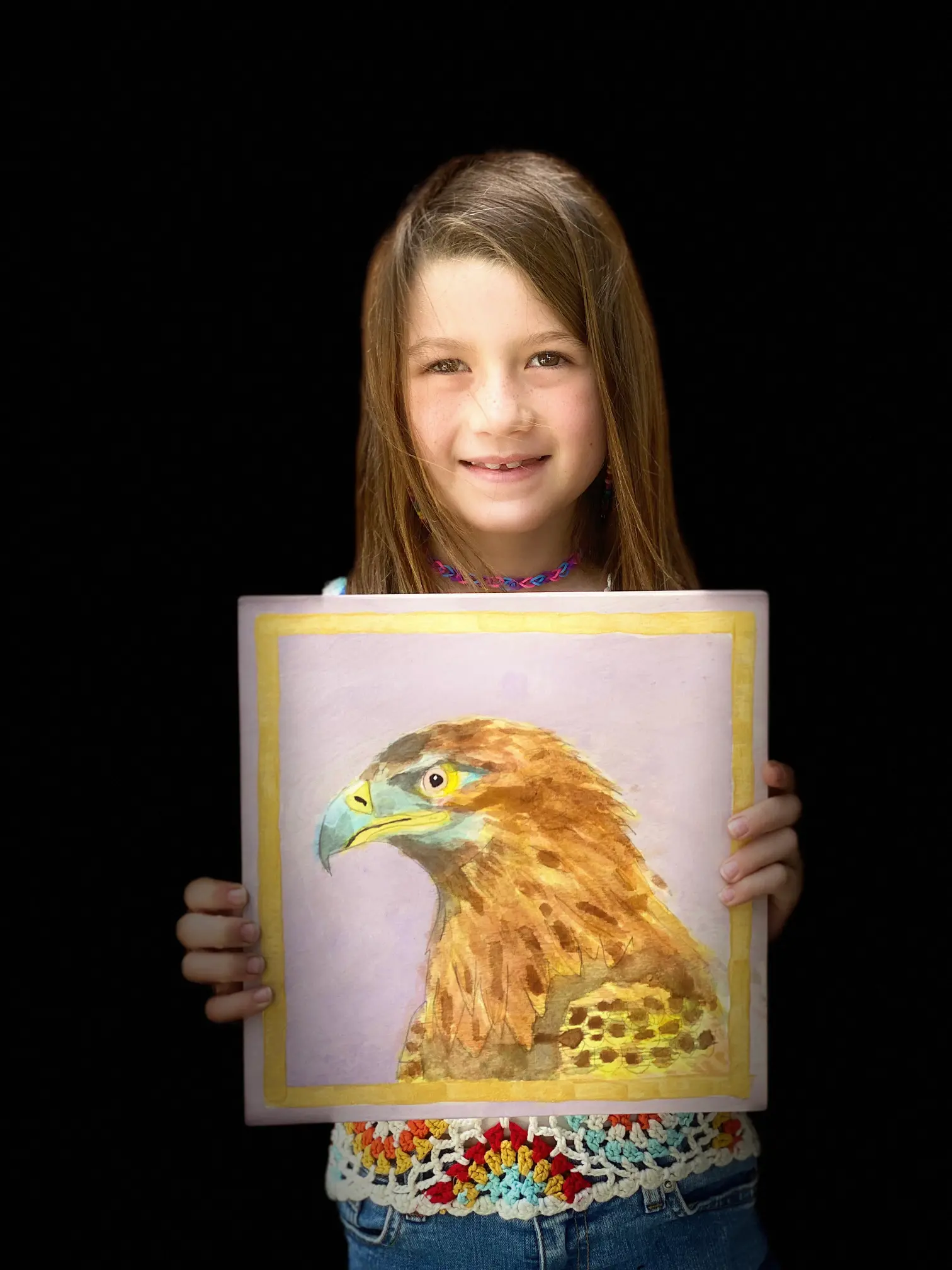 Girl displaying her hawk drawing