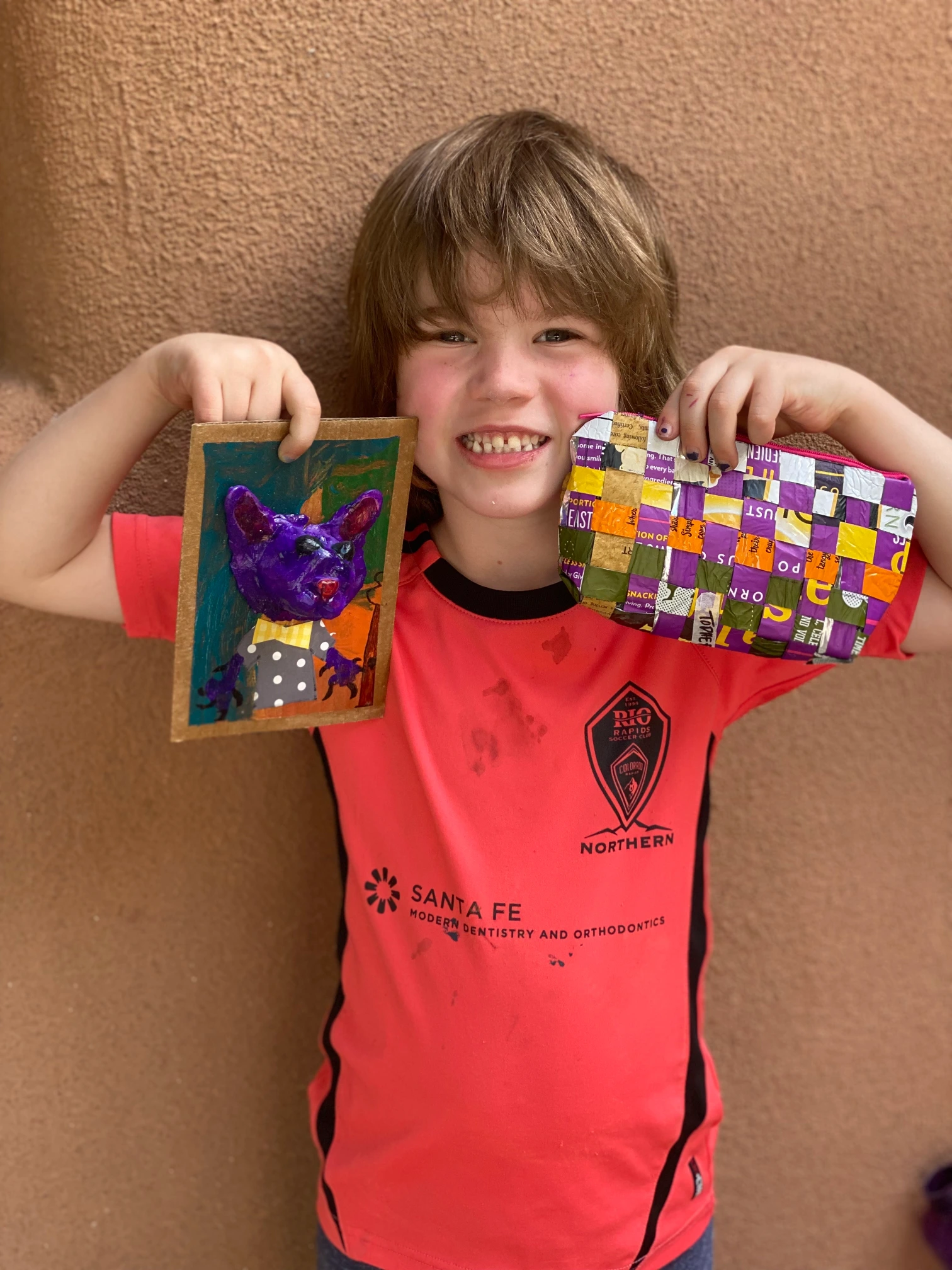 artwork of young boy holding his cat picture