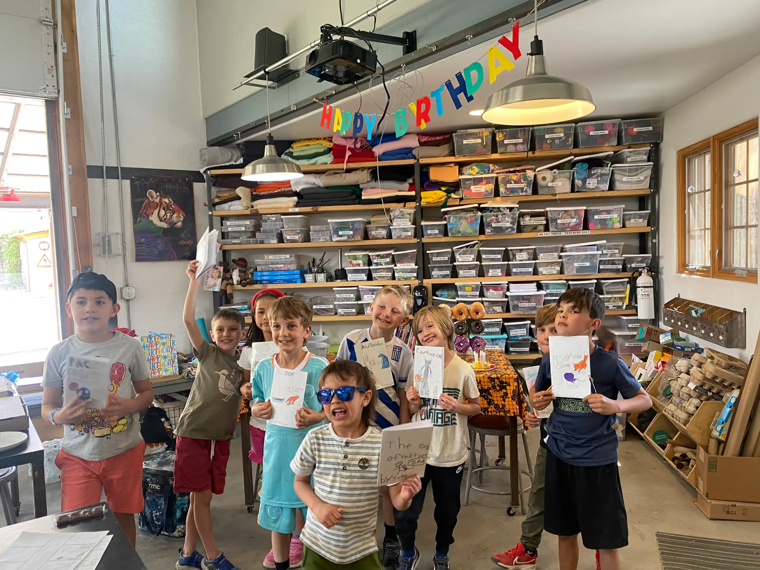 kids showing off their artwork