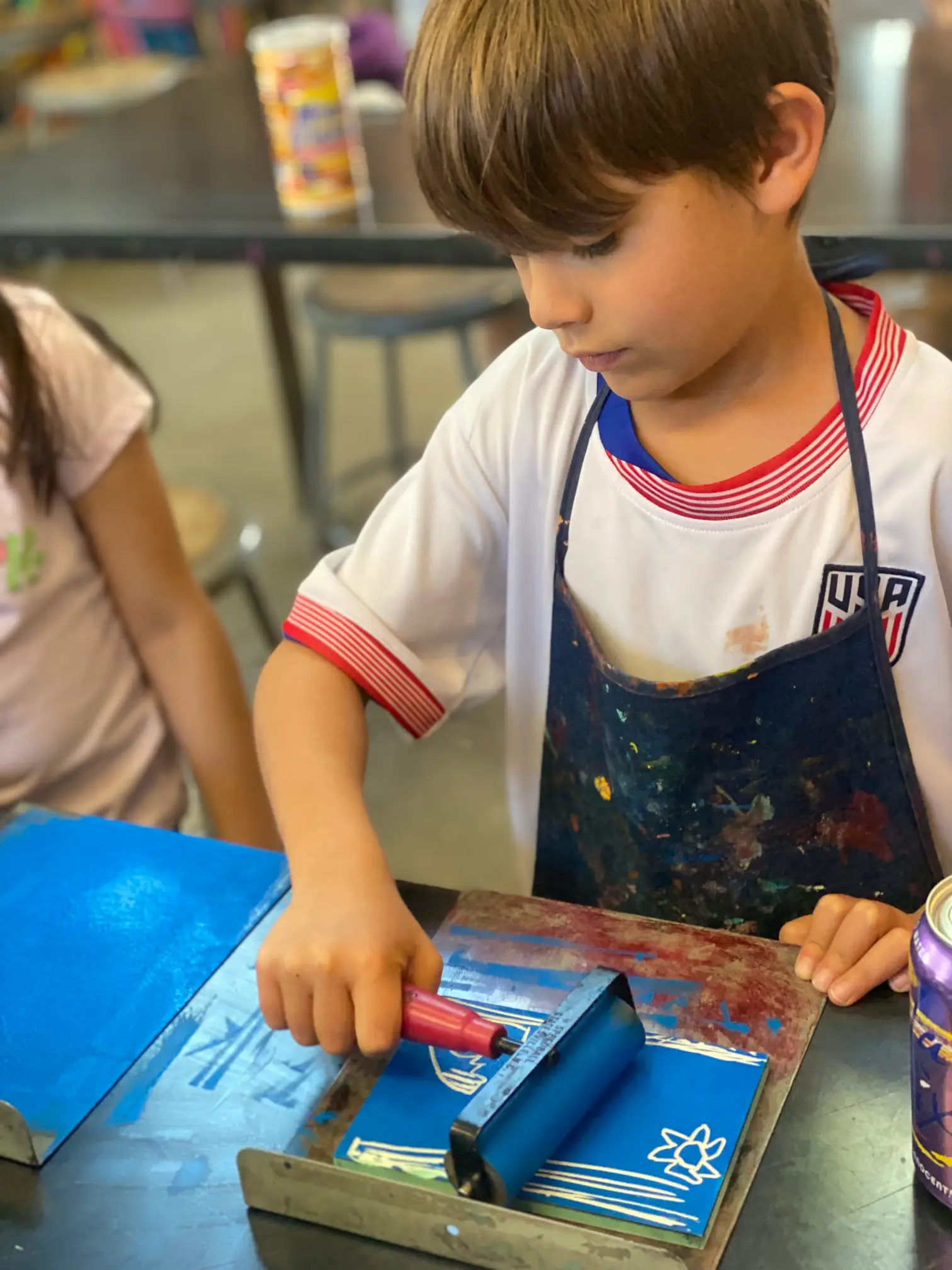 boy working on art piece