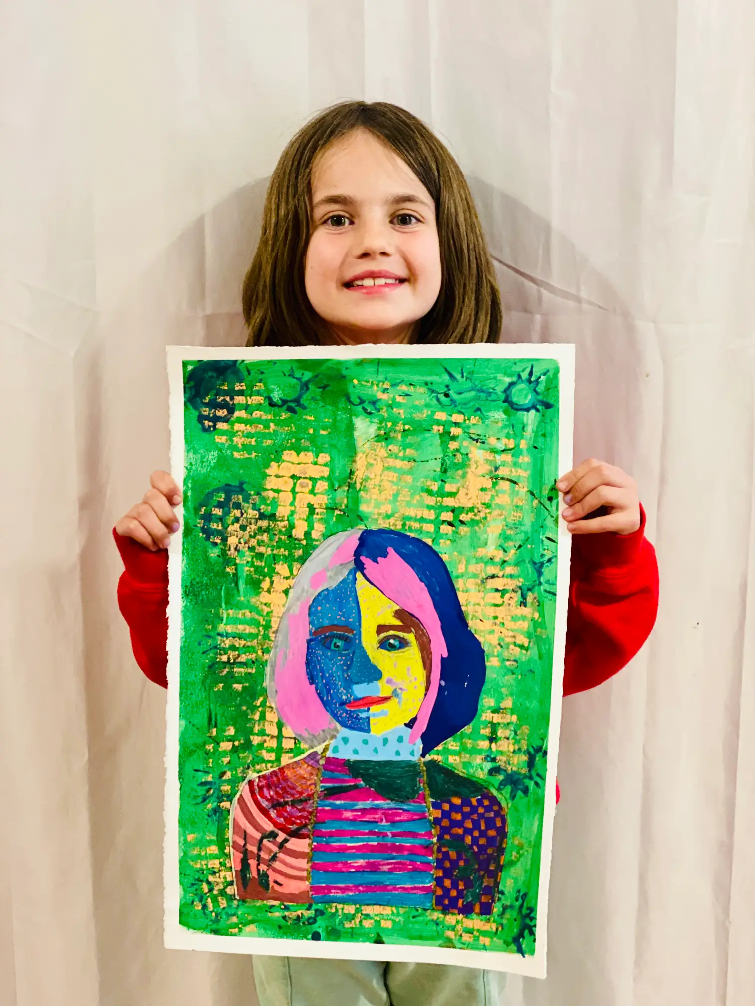 Student showing off artwork