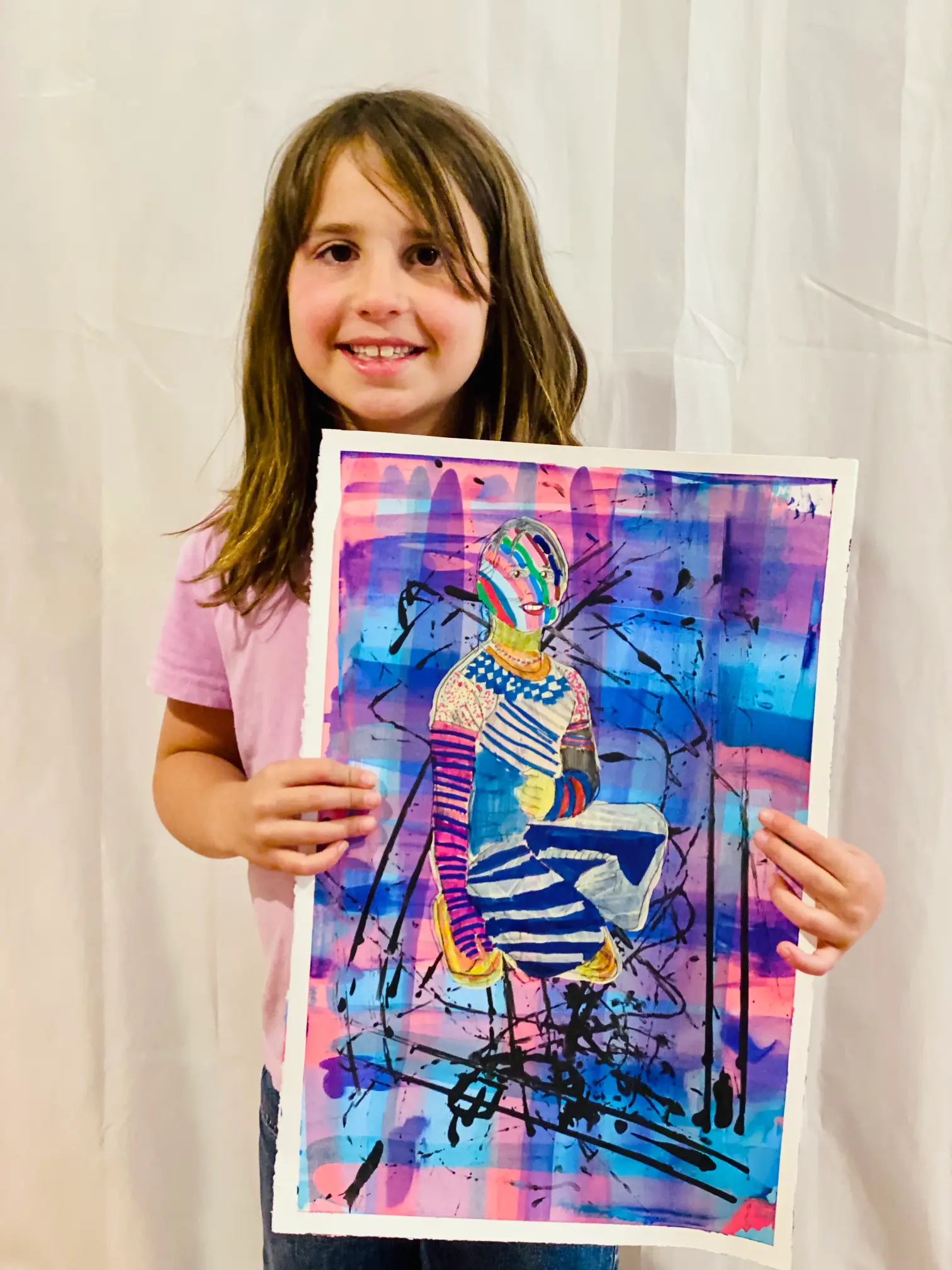 Student showing off artwork