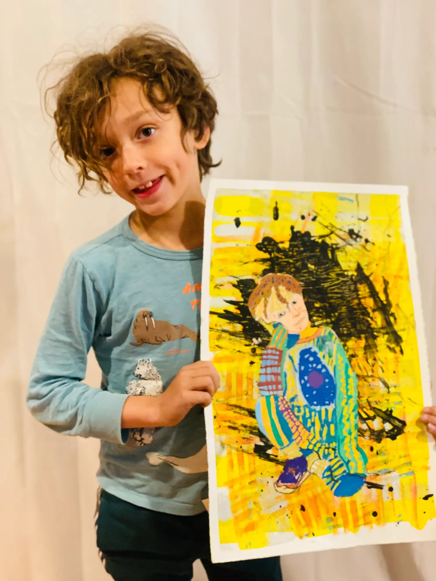 Student showing off artwork