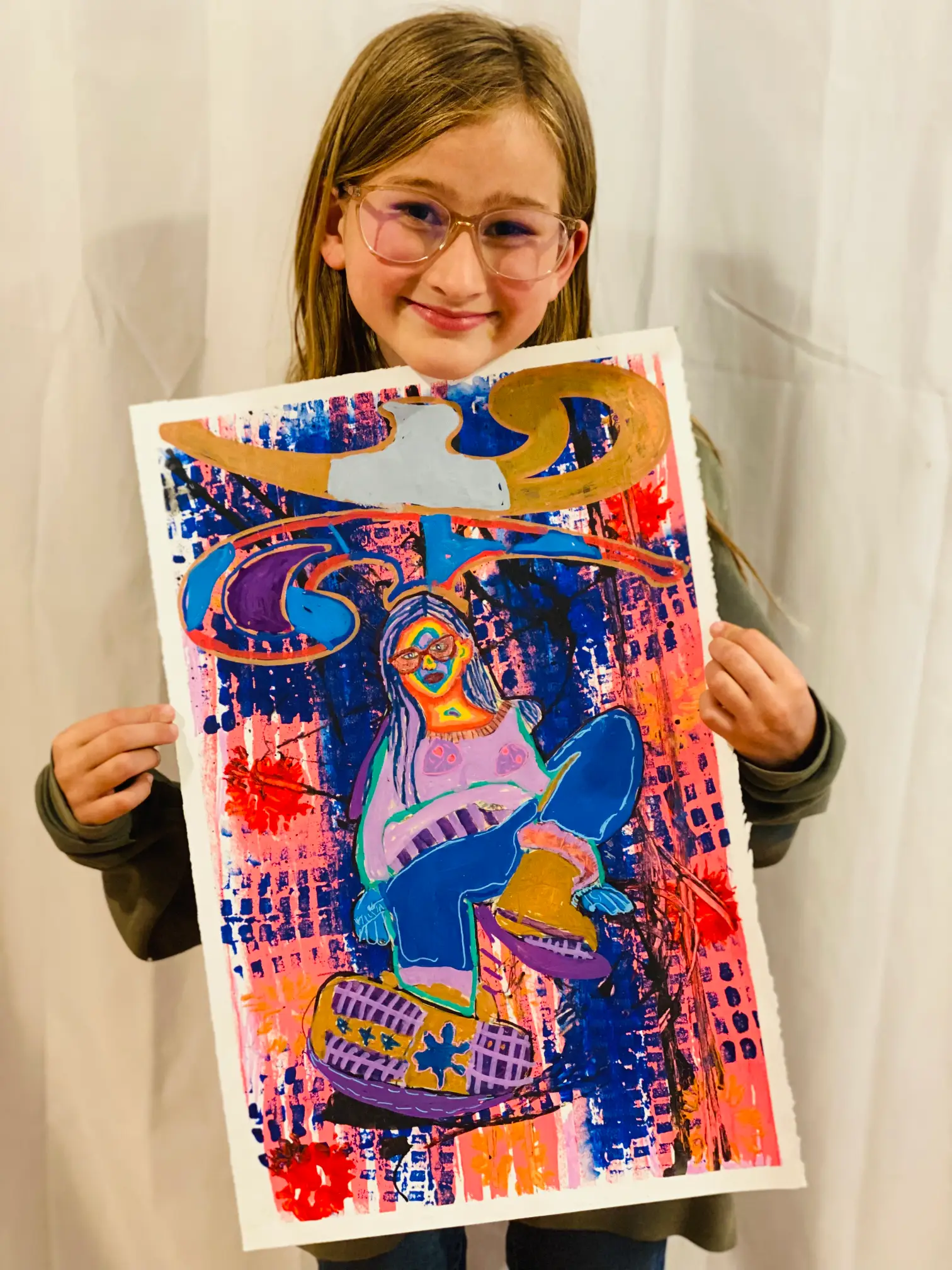 Student showing off artwork