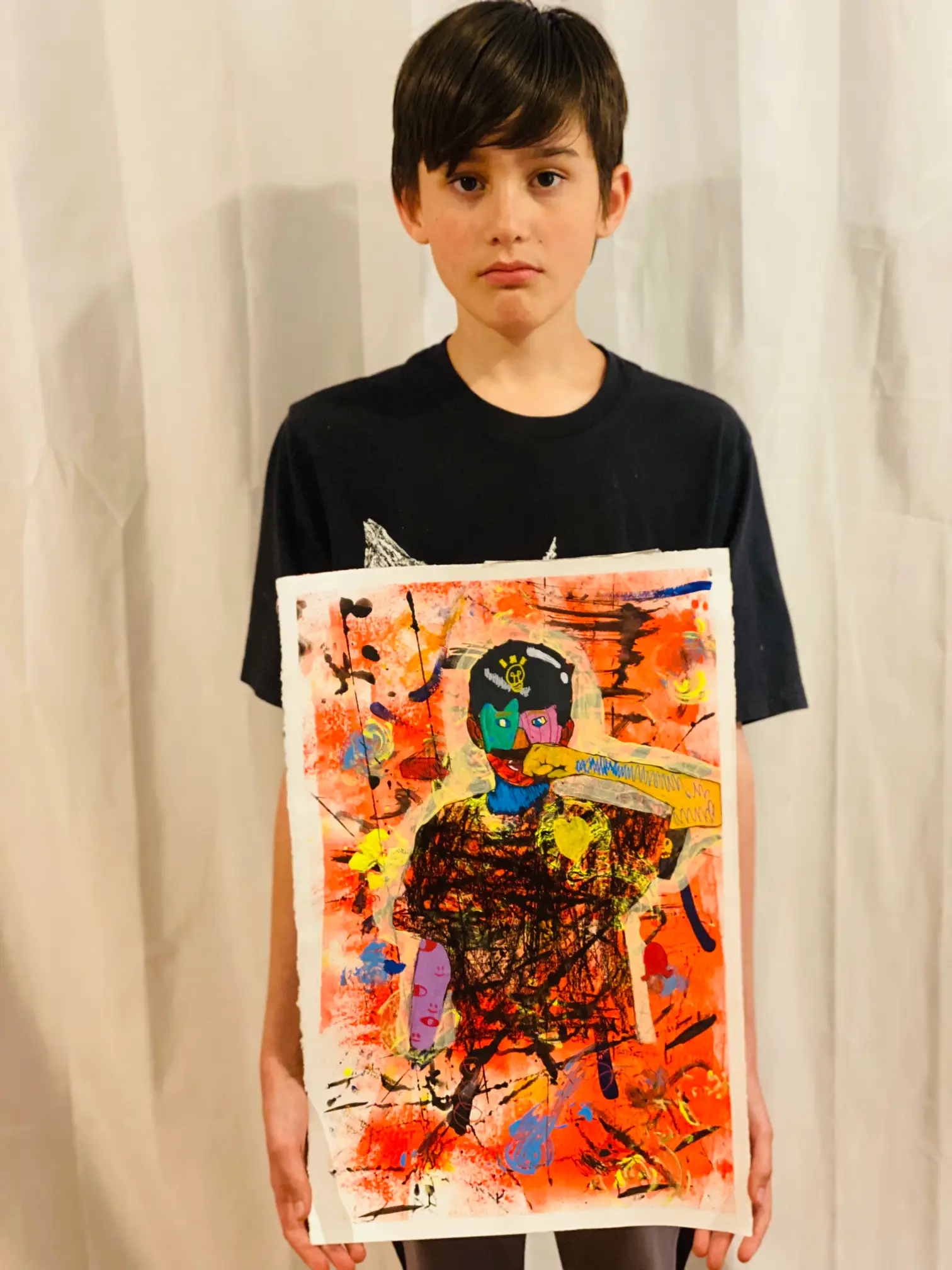 Student showing off artwork