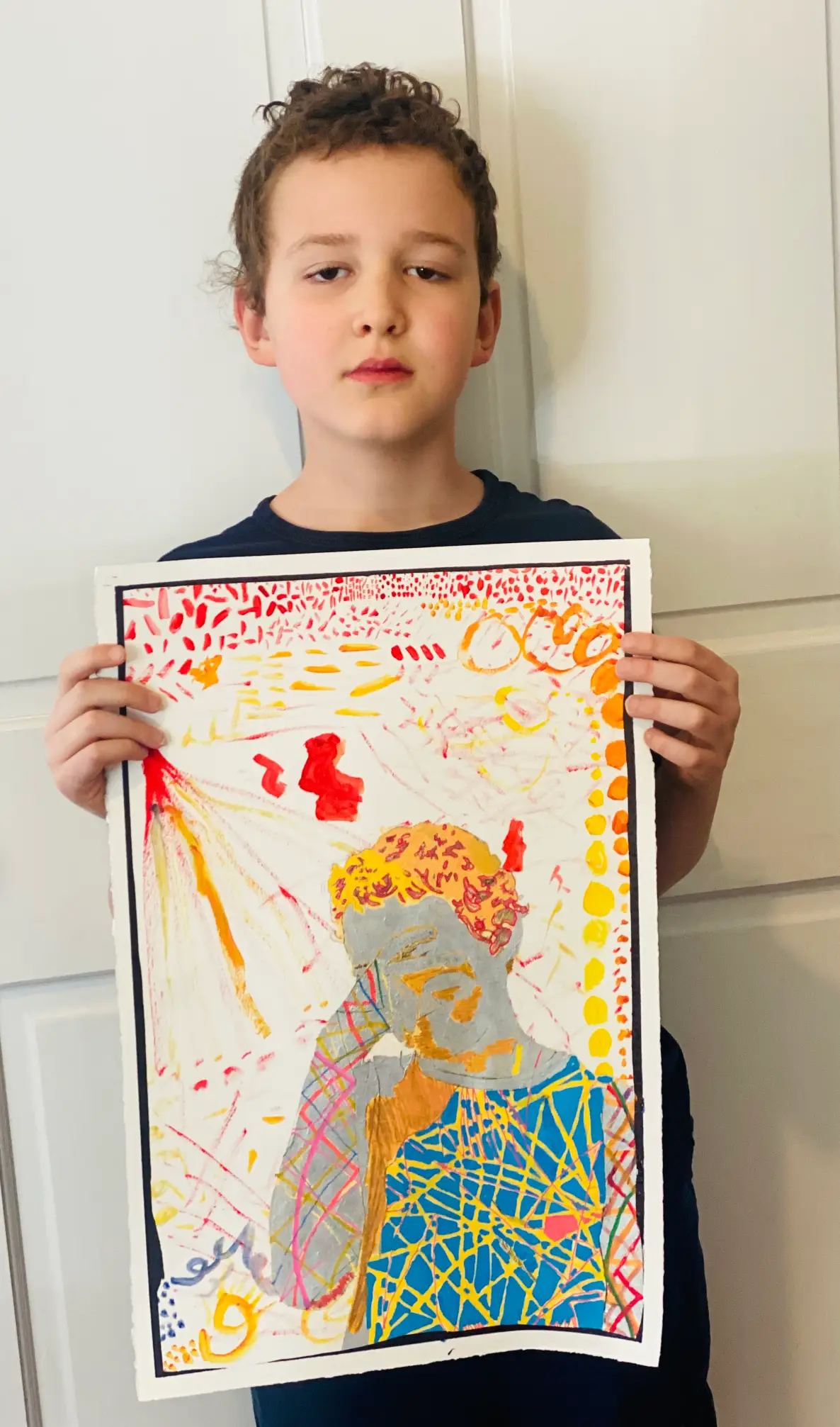 Student showing off artwork