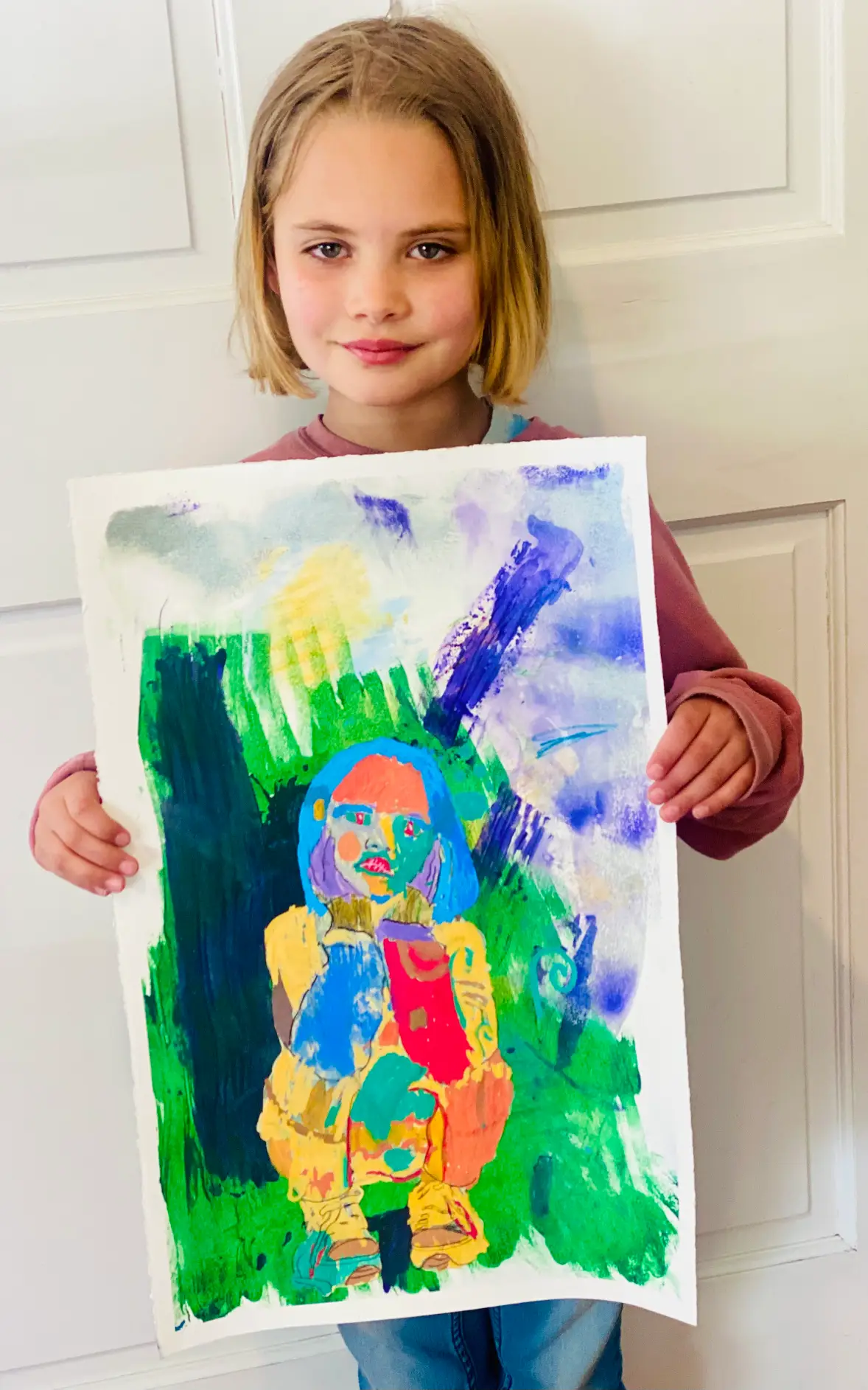 Student showing off artwork