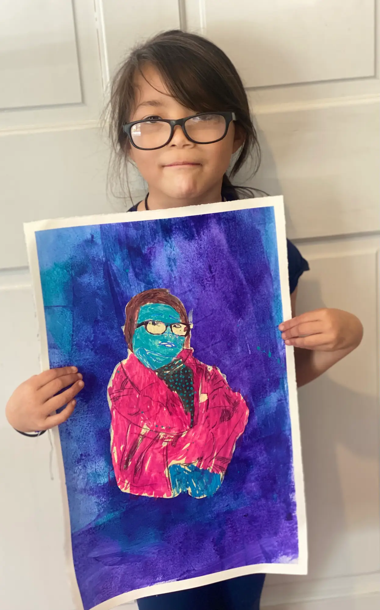 Student showing off artwork