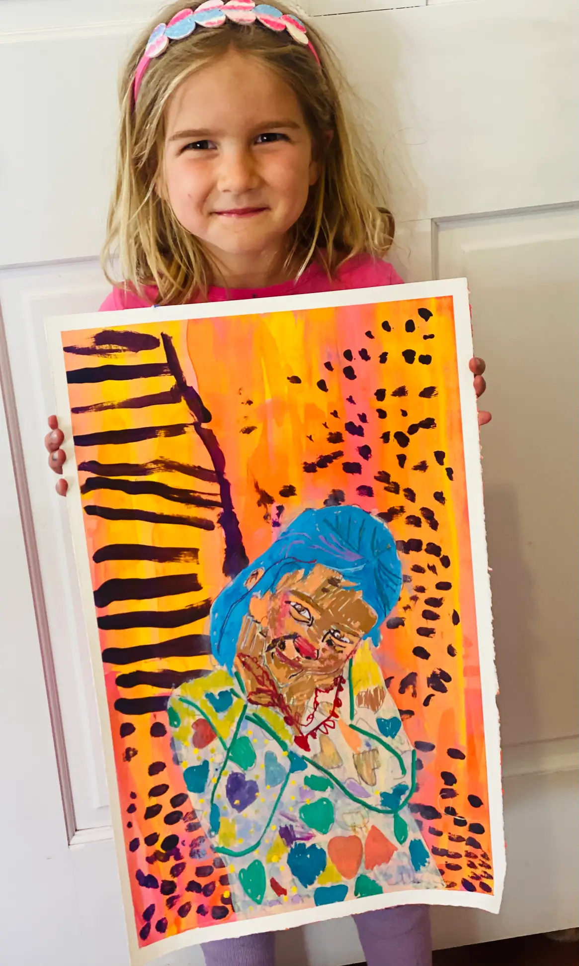 Student showing off artwork