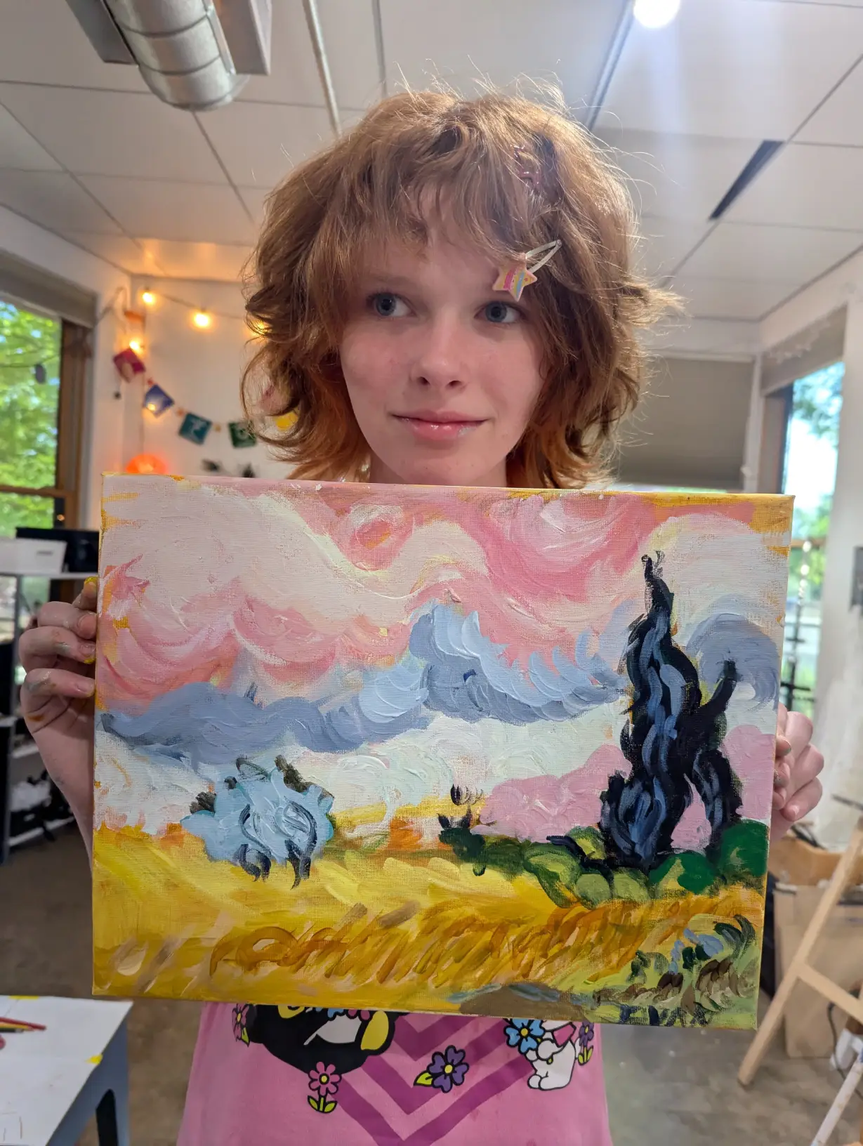 Student displaying artwork