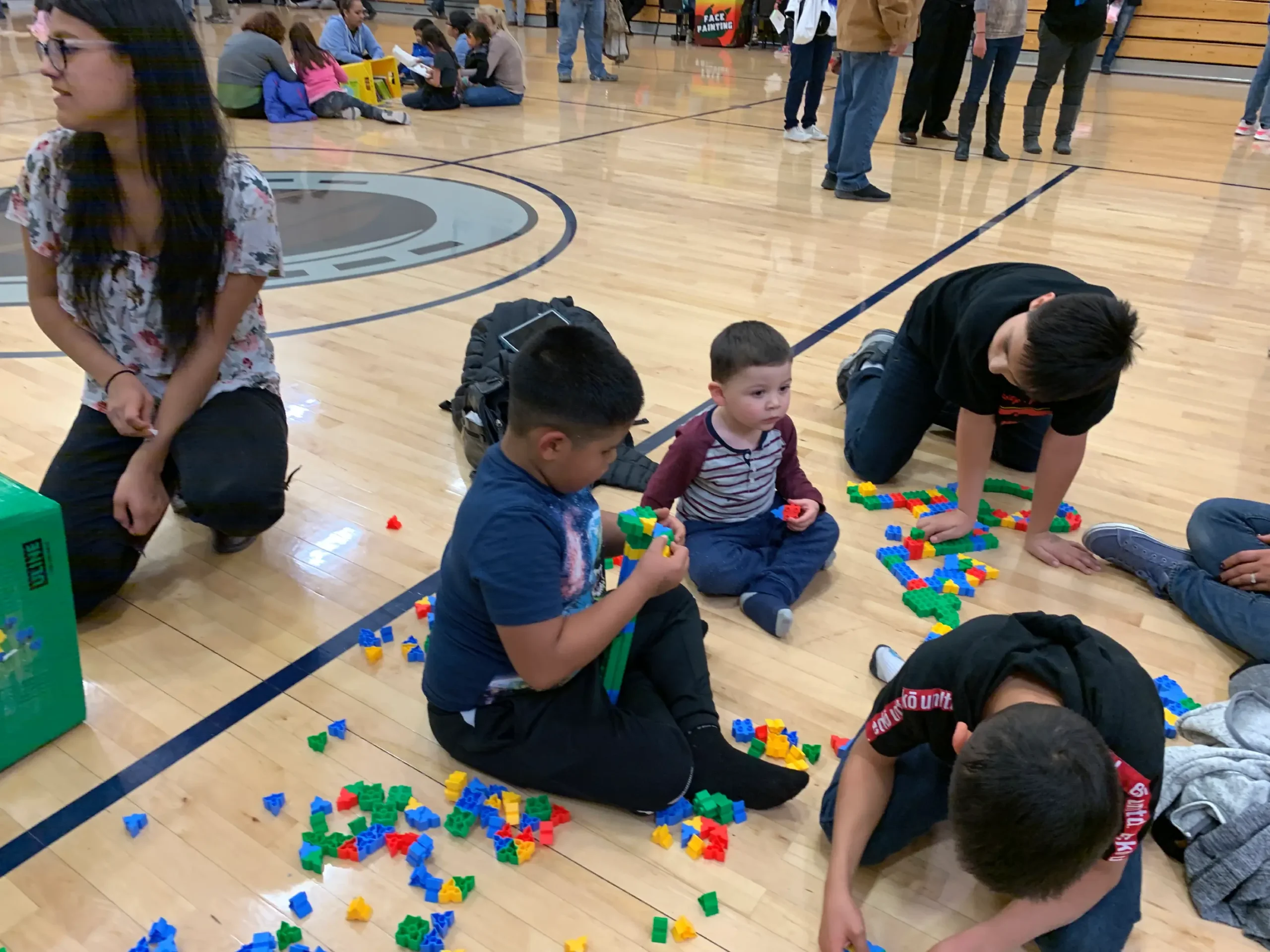 School STEM Family Night, children playing a game with snap blocks School STEM Family Night, children playing a game with snap blocks