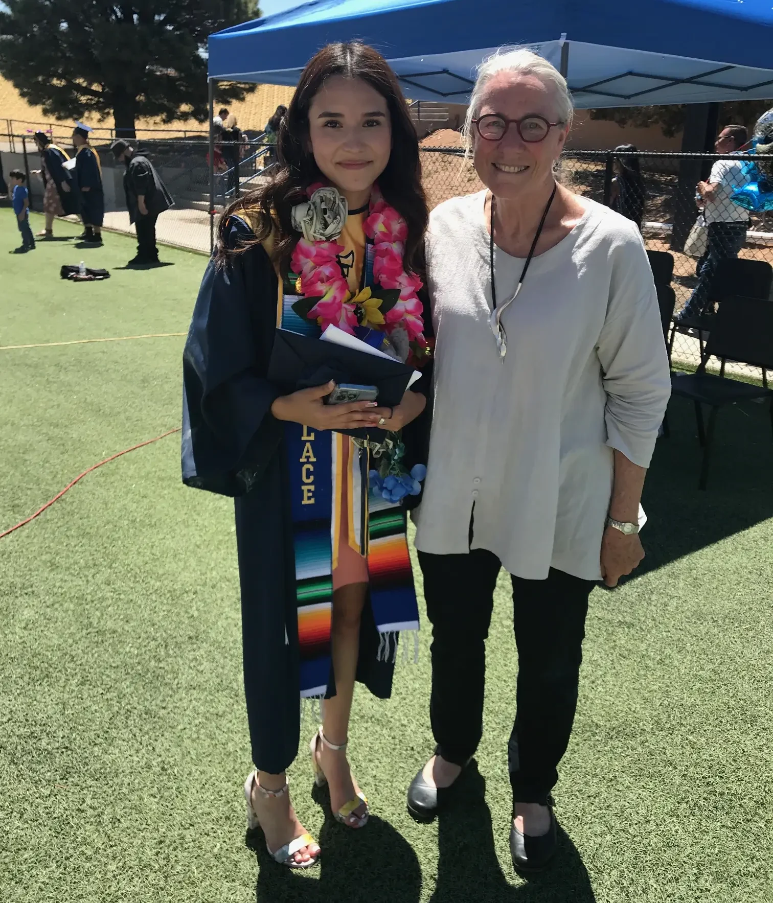 TanyaMedranoDrGilbert Tanya Medrano, a Santa Fe High School graduate, stands with Dr. Julanna Gilbert during her commencement ceremony. Dr. Gilbert and Medrano collaborated on a computer-based project exploring the creation of art through reiterative mathematics.